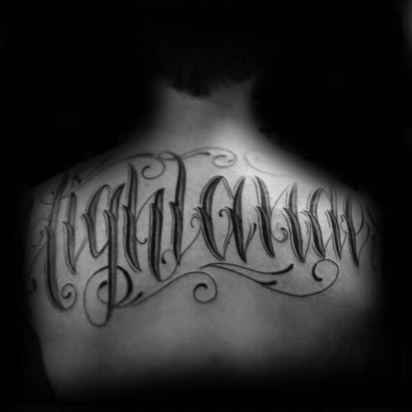 Last Name Script Male Black Ink Ornate Tattoo On Upper Back