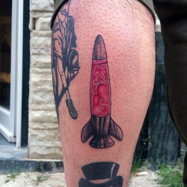 Rocket-shaped lava lamp tattoo with red bubbling wax, perfect for men's creative and adventurous tattoo inspiration.
