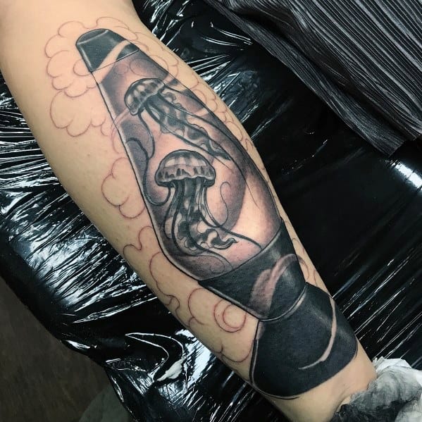 Black and grey lava lamp tattoo featuring graceful jellyfish inside, perfect for men's elegant and creative tattoo inspiration.
