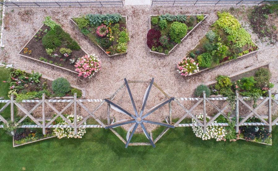 large backyard with raised garden bedds