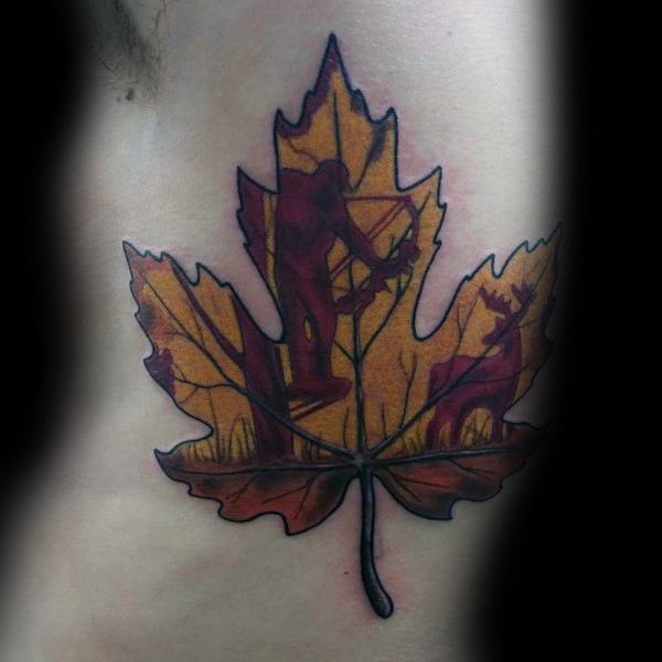 Color tattoo of a maple leaf filled with silhouettes of a bowhunter aiming at a deer, set against a warm autumn-toned background.