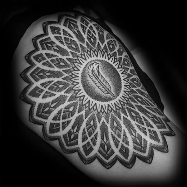 Intricate dotwork shoulder tattoo featuring Led Zeppelin's feather symbol at the center of a large mandala-style geometric pattern.