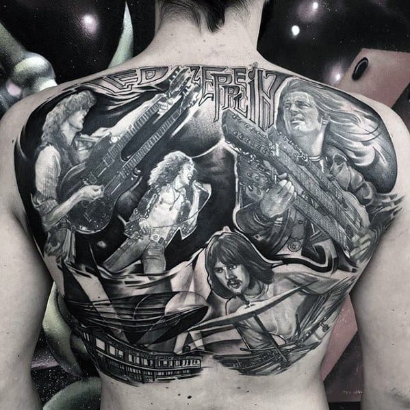 Full back tattoo of Led Zeppelin members performing, with dramatic shading, band logo, and a Zeppelin airship in the foreground.