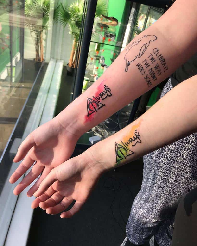 Matching Harry Potter-inspired sister tattoos with the word 'Always' inside the Deathly Hallows symbol, accented with colorful watercolor effects