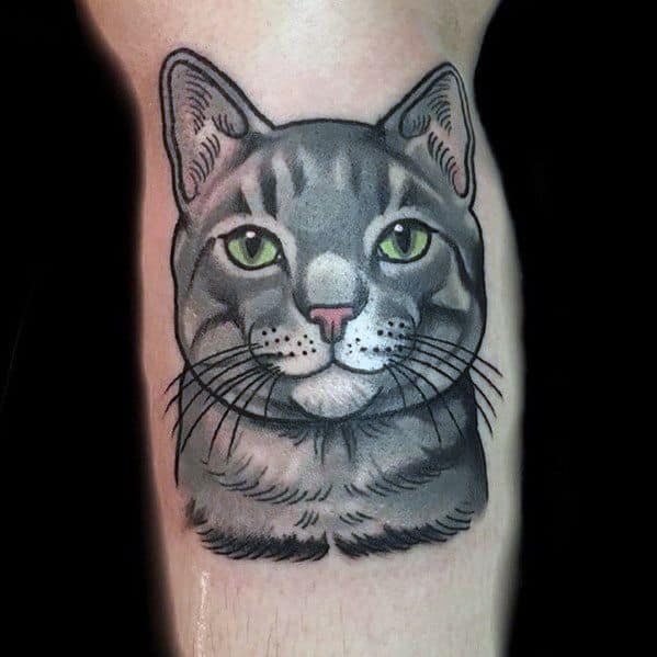 Bold neo-traditional cat tattoo with vibrant green eyes, crisp outlines, and smooth shading for a classic and striking design.