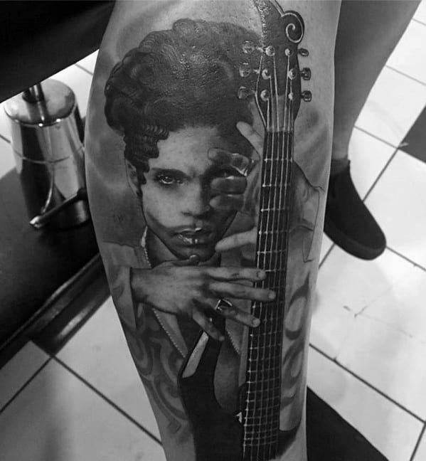 A hyper-realistic tattoo of Prince holding his guitar, exuding his signature charisma and iconic style