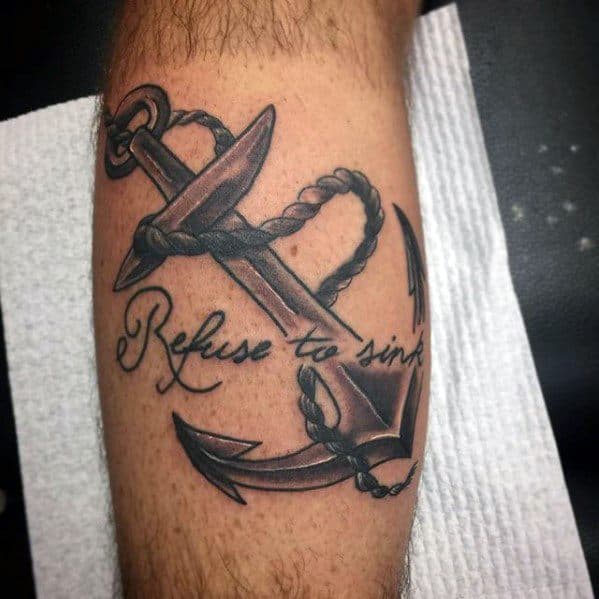 Refuse To Sink" inked with an anchor on the arm