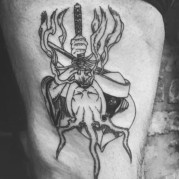 Black ink tattoo of Genryusai Yamamoto from Bleach, featuring his intense gaze, flaming sword, and abstract smoke-like details