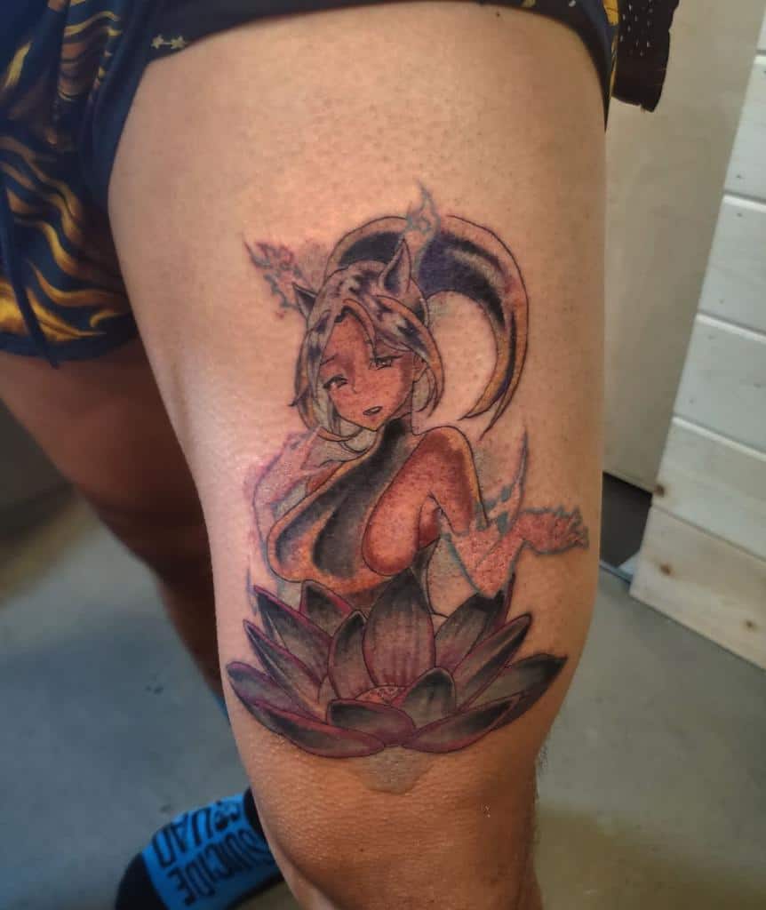 Colorful tattoo of Yoruichi Shihouin from Bleach, featuring her cat-like ears, flowing hair, and a blooming lotus flower design 