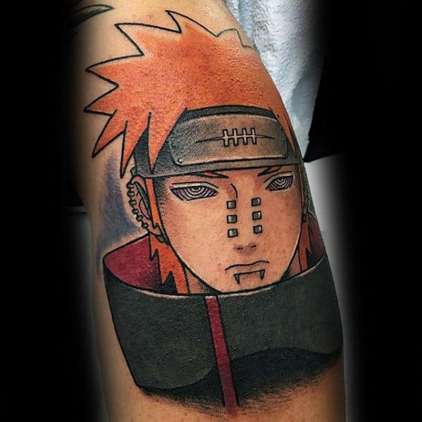 Tattoo of Naruto with spiky orange hair and a headband on an arm