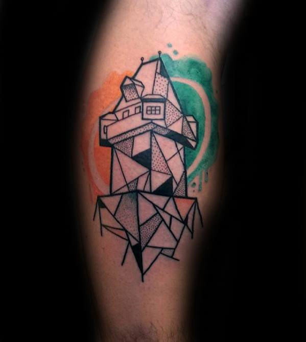 Cubist tattoo of a geometric lighthouse with black linework and dot shading, set against watercolor-style orange and green background swirls.