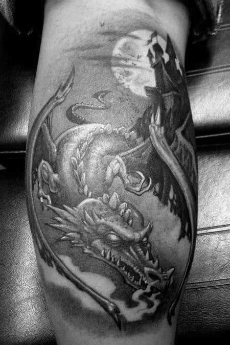 Black and white tattoo featuring a dragon with a castle and full moon in the background
