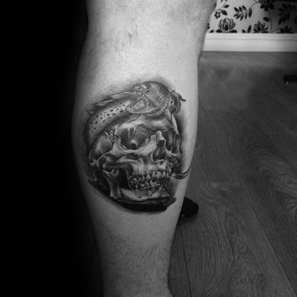 Leg Calf Male Tattoo With Eel Wrapped Around Skull Design