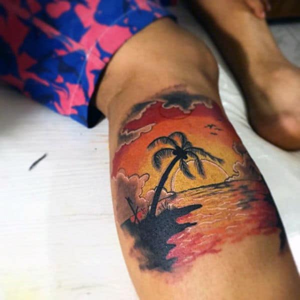 Leg Calf Mens Beach Sunset Tattoo In Orange Ink