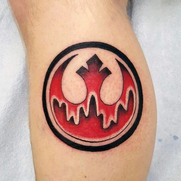 Red and black Rebel Alliance tattoo on upper calf, with a dripping paint effect in the design.