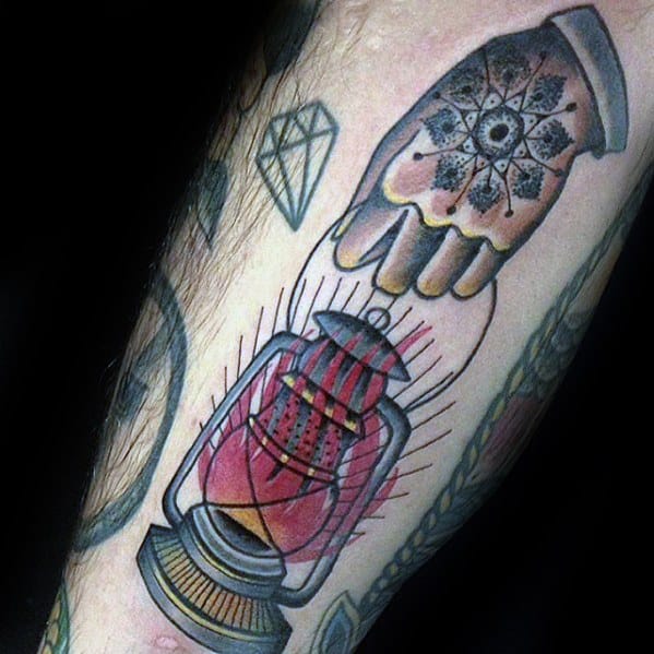 Leg Hand Holding Flaming Lantern Guys Tattoo Designs