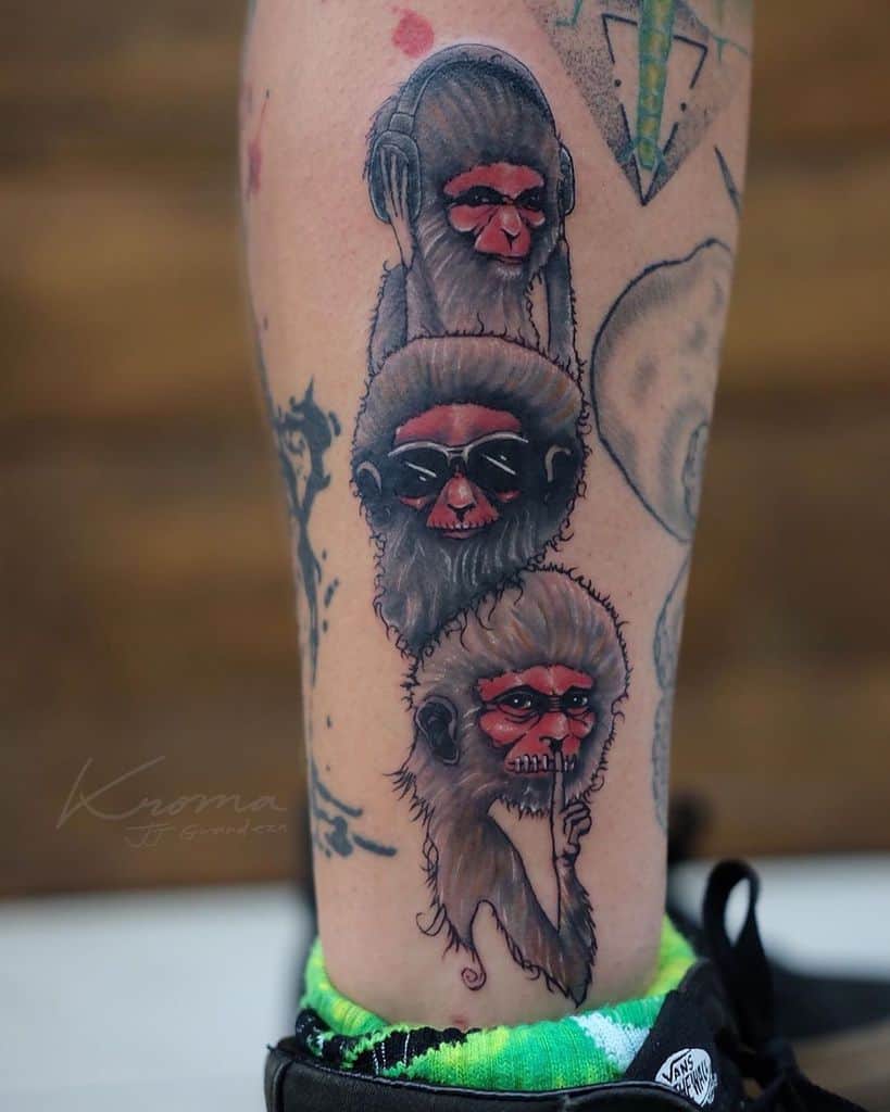 Tattoo of three wise monkeys: one with headphones, one with sunglasses, and one covering its mouth
