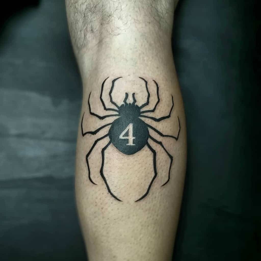 Spider tattoo featuring the number 4, inspired by Hunter X Hunter, on a lower leg