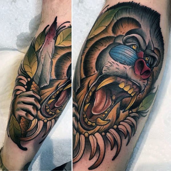 Neo-traditional baboon tattoo with bold colors, fierce expression, and a bloodied knife, featuring intricate shading and dynamic details on the leg.