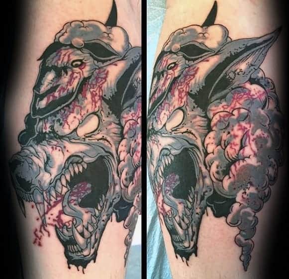 Colorful leg tattoo featuring a fierce 'wolf in sheep's clothing' design, with the wolf's snarling face emerging from the sheep's disguise, highlighted by dramatic blood splatters and bold linework