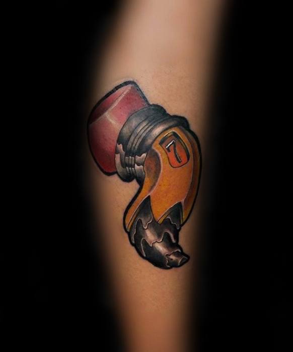 A tattoo of a vintage-style microphone is etched on the skin, surrounded by dynamic flames, as if sketched with a pencil to capture every intricate detail