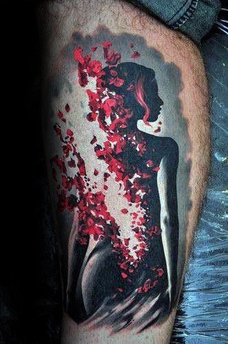 Surreal tattoo of a woman's silhouette dissolving into red petals, blending elegance with a sense of fading or transformation.