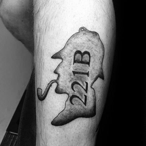 Tattoo of Sherlock Holmes' silhouette with a pipe and the number "221B"