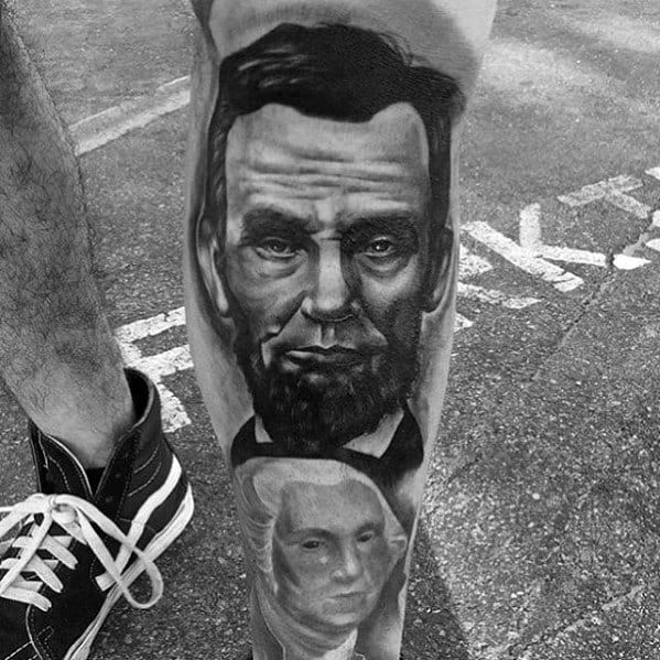 Black and white tattoo of Abraham Lincoln and other historical figures on a person's leg