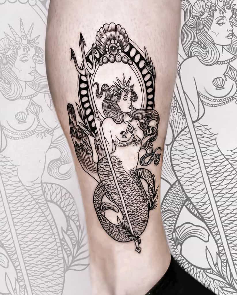 Intricate blackwork tattoo of a regal mermaid holding a trident, framed by ornate seashell and pearl details