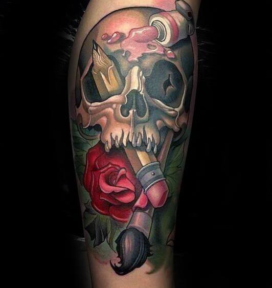 A tattoo featuring a skull intricately designed with a pencil, rose, paintbrush, and paint tube captures the essence of artistry and creativity