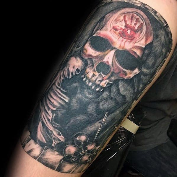 Skyrim-inspired tattoo of a skull with a red handprint and intricate shading on an arm