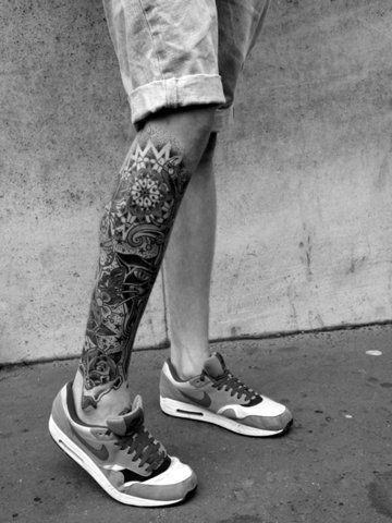 Geometric and floral leg sleeve tattoo