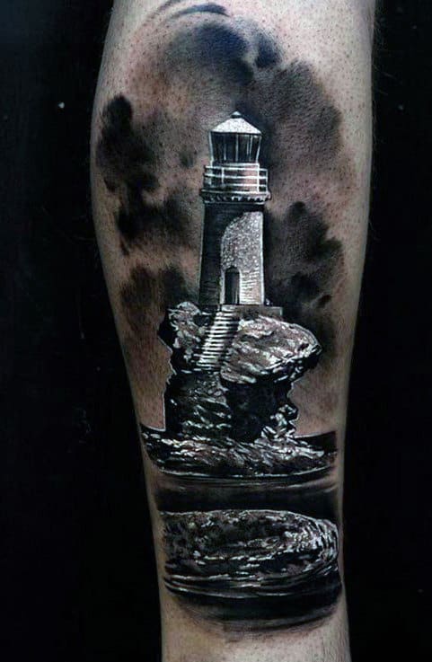 Tattoo of a lighthouse on a rocky outcrop with dark clouds in the background
