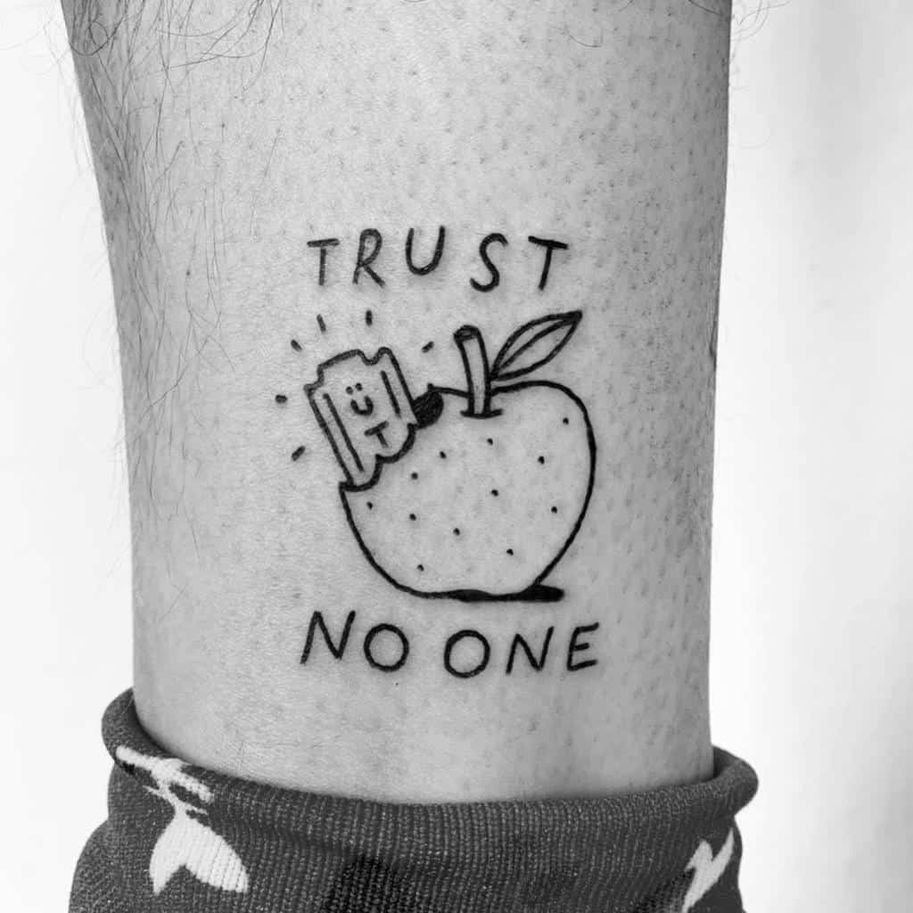 Minimalistic tattoo of a smiling razor blade emerging from an apple with the words 'Trust No One' above and below the image