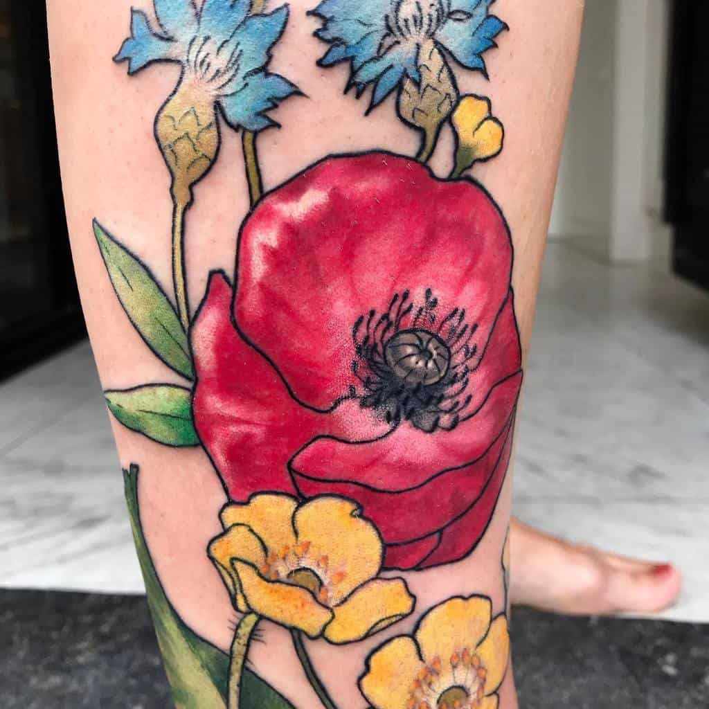 Colorful floral tattoo featuring a large red flower surrounded by smaller blue and yellow flowers