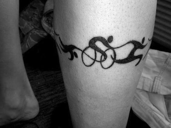 A minimalist black tattoo depicting the flow of an Ironman race, with abstract figures representing swimming, cycling, and running.