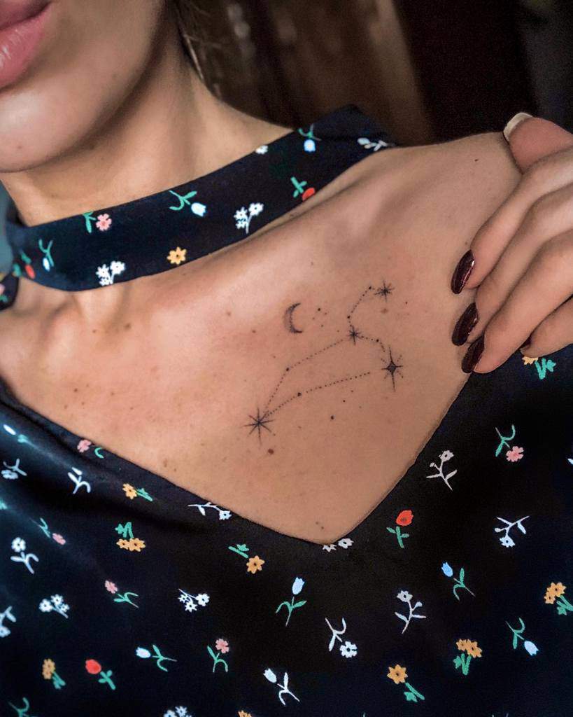 Collarbone tattoo of the Leo star constellation, enhanced with a crescent moon and celestial accents for a mystical look.
