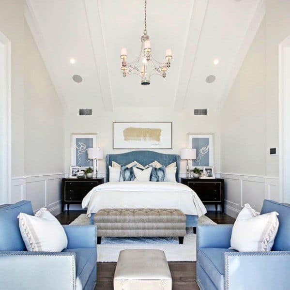 light blue and white master bedroom with high ceilings