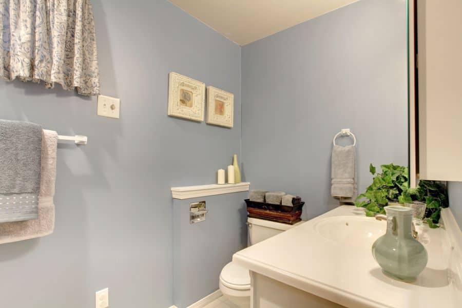 light blue painted bathroom with white vanity 