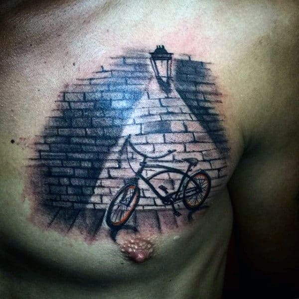 Light Focused Bicycle Tattoo On Chest Male