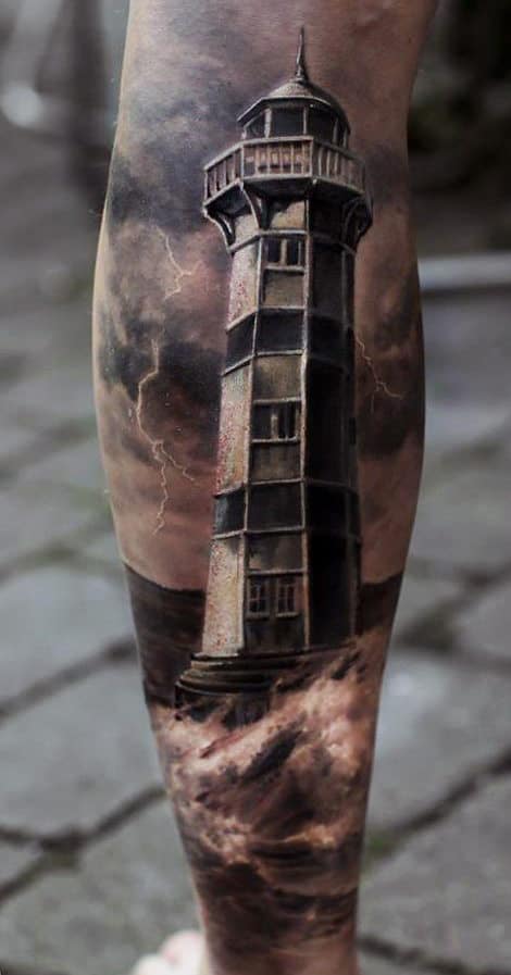 Lighthouse tattoo on a person's leg with a dark, stormy background