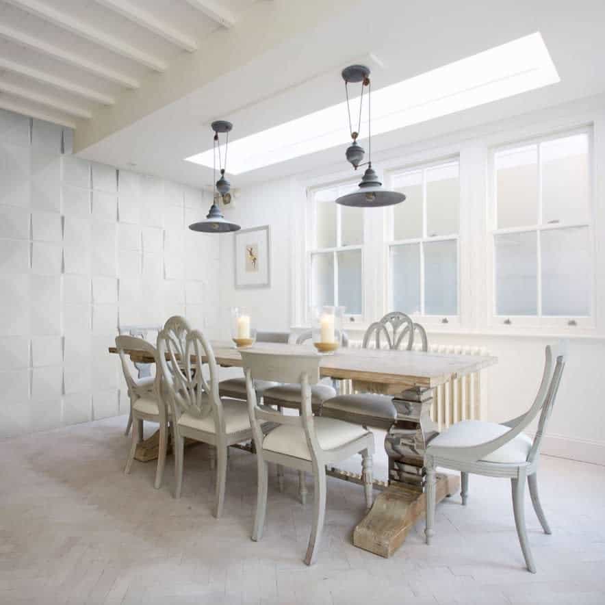 rustic white dining room vintage table mismatched chairs pendant lights