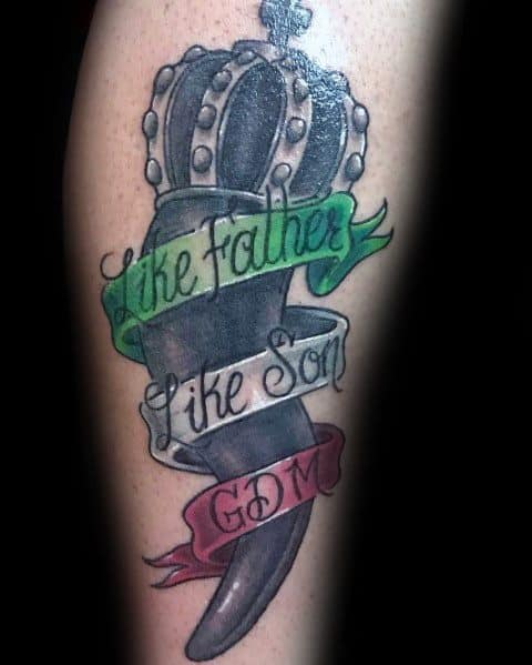 Italian horn tattoo with a crowned design and tricolor banner reading 'Like Father Like Son GDM,' symbolizing heritage and family pride.