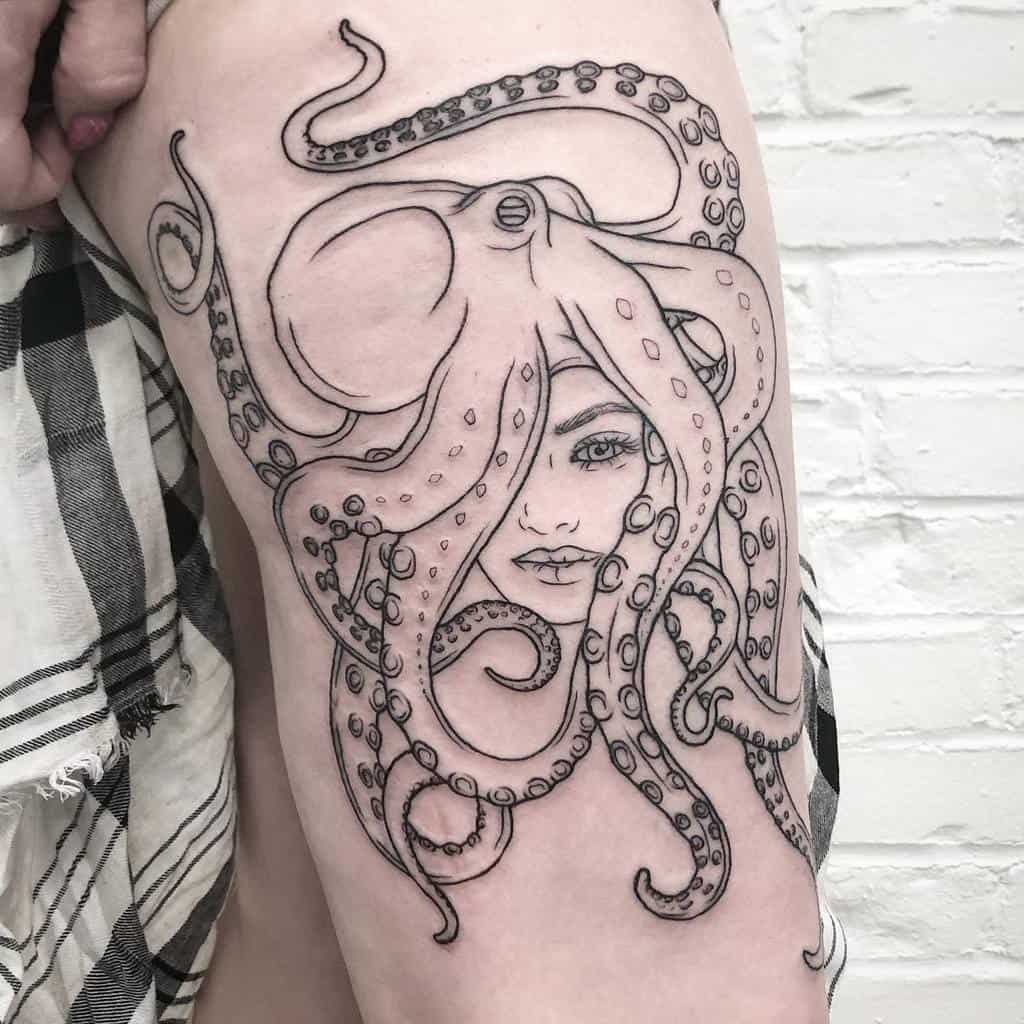 Black line tattoo of a surreal octopus-woman hybrid, with tentacles flowing around her detailed face, creating an ocean-inspired design.