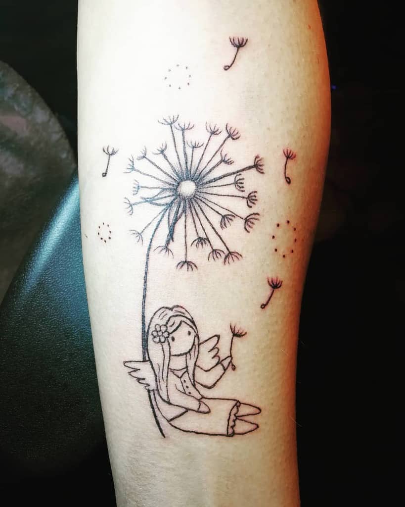 A tattoo of an angel girl sitting and holding a dandelion, with seeds floating away on the forearm, drawn in a delicate style.
