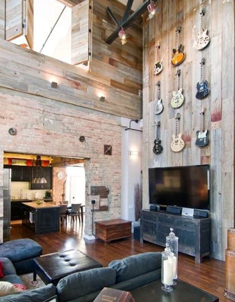 high ceiling barn living room hanging guitar wall art 
