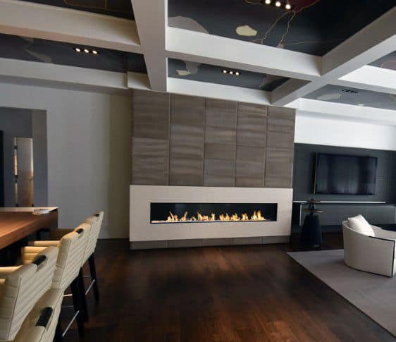 Sleek linear gas fireplace with a white surround and modern paneled accent wall.