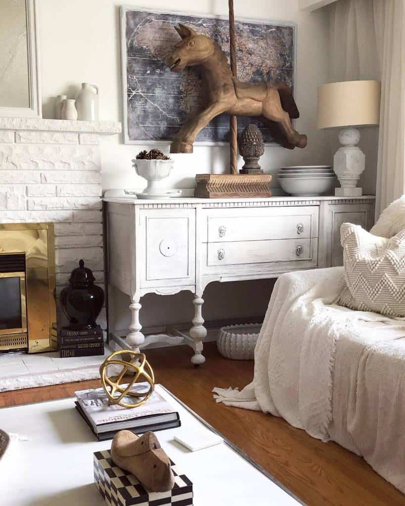 white painted wood cabinet stone fireplace horse statue 