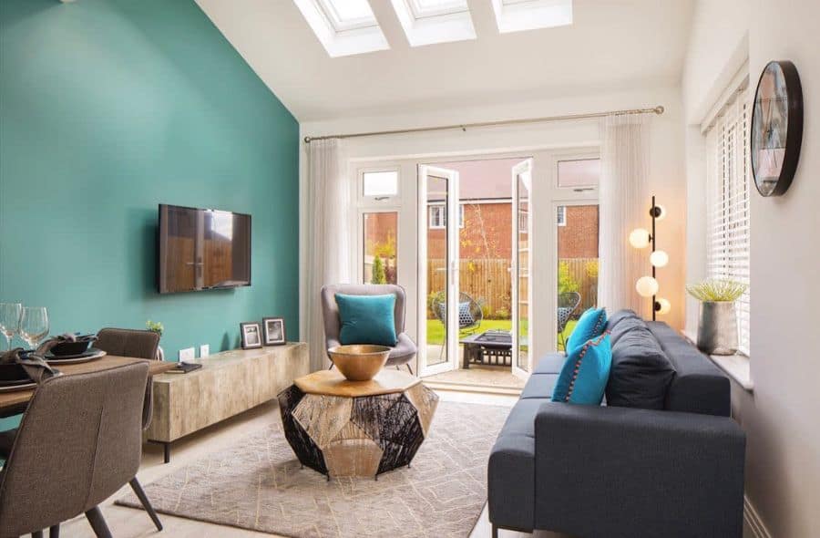 living room with green accent wall