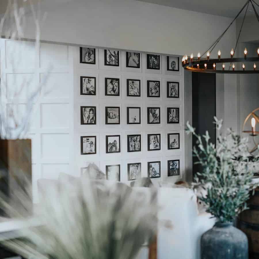 framed black and white family photos hanging on living room wall